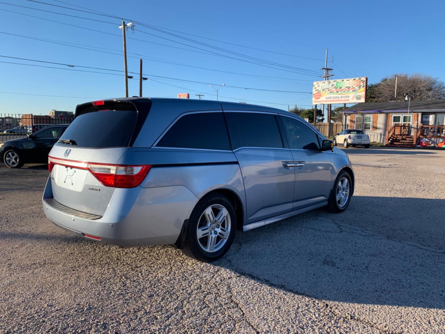 2012 Blue /gray Honda Odyssey Touring (5FNRL5H94CB) with an 3.7L L5 DOHC 20V engine, AUTOMATIC transmission, located at 1830 North Belt Line Road, Irving, TX, 75061, (469) 524-0199, 32.834373, -96.993584 - Photo#5